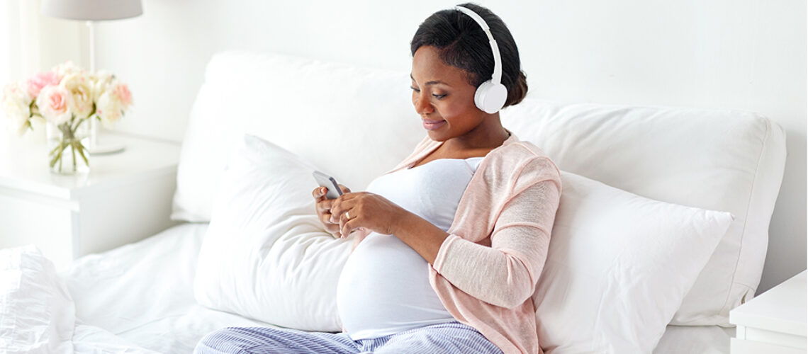 pregnant-woman-in-headphones-with-smartphone-2